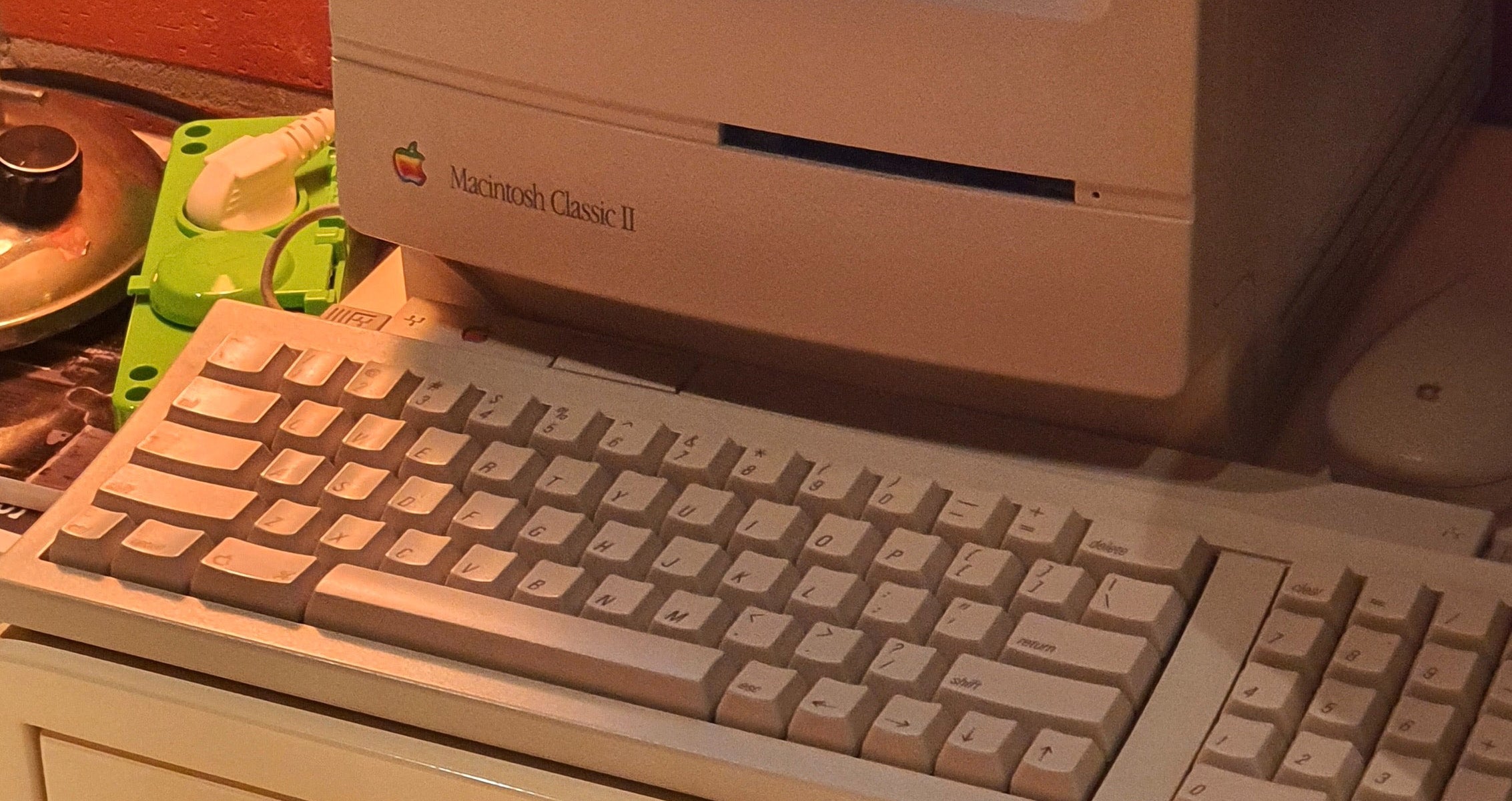 macintosh classic computer and keyboard